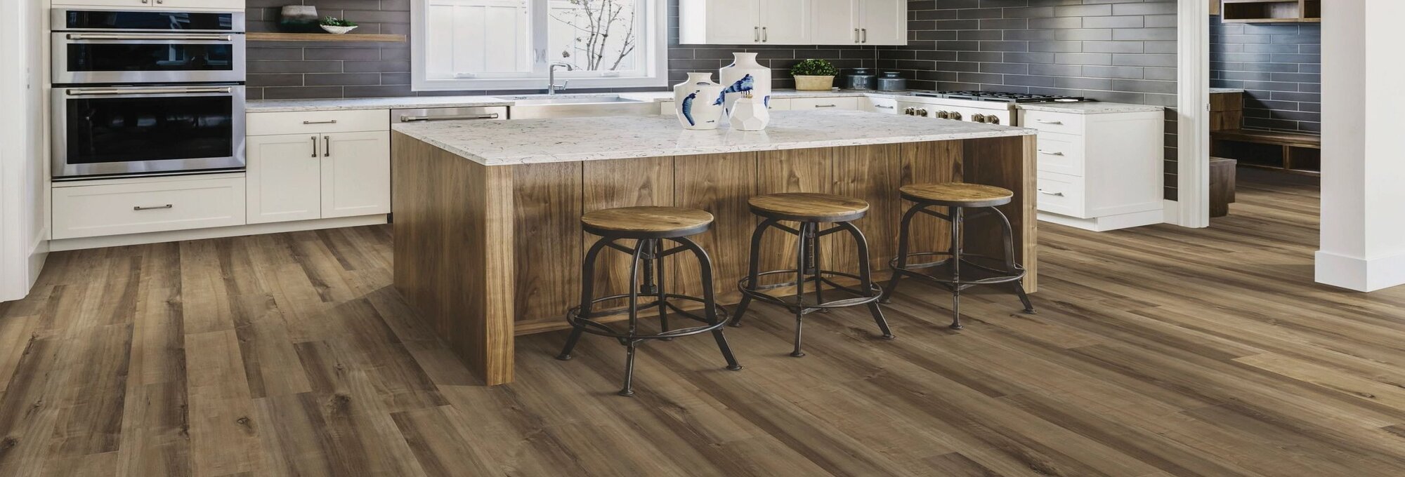 Modern kitchen with wood-look luxury vinyl flooring from Success Floor Covering LLC in Oakland, MD